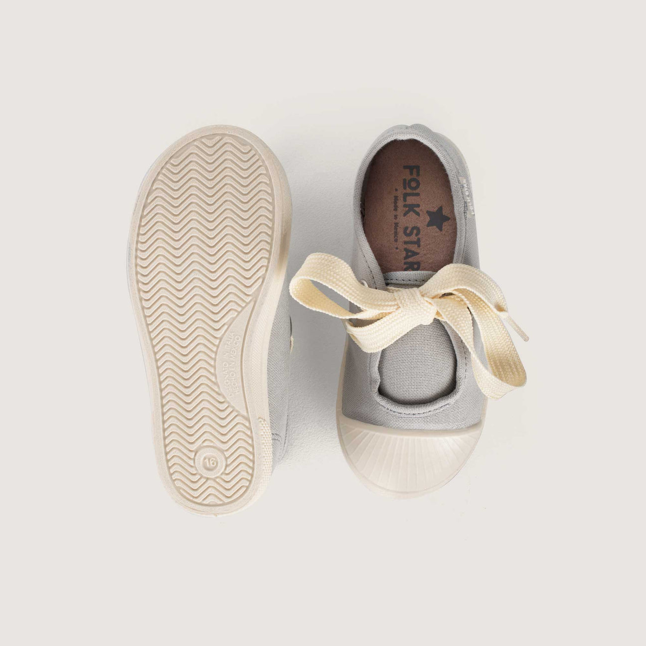 TENIS GRIS AGUJETA